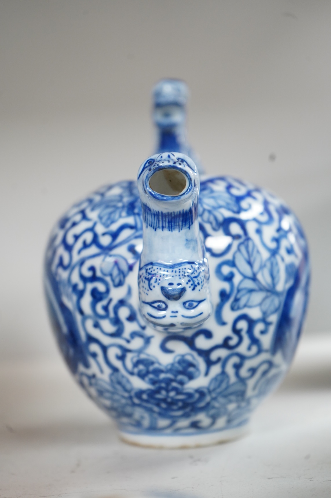 A group of Chinese blue and white comprising a dish and cover, two pillows, waterdropper and a teapot, largest 26cm wide